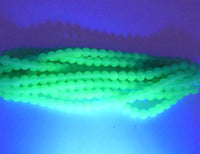 Czech Round (Druk) glass beads 5mm round Opaline Mint Green Uranium Glow. - Bead Nerd