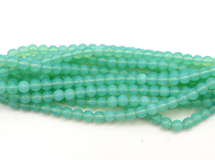 Czech Round (Druk) glass beads 5mm round Opaline Mint Green Uranium Glow. - Bead Nerd